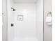 This bathroom features a modern shower with white subway tile, a shower niche, and matte black hardware at 209 Howard Ave, Arcadia, IN 46030
