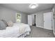 Bright bedroom with a comfortable bed, soft carpet, and ample natural light, offering a cozy space at 209 Howard Ave, Arcadia, IN 46030