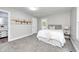 Comfortable bedroom with neutral tones, soft carpet, and a cozy bed, creating a relaxing retreat at 209 Howard Ave, Arcadia, IN 46030