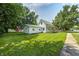 Charming two-story home with a well-maintained lawn and mature trees at 209 Howard Ave, Arcadia, IN 46030