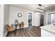 Open-concept kitchen and dining area with modern stainless steel appliances and great natural light at 209 Howard Ave, Arcadia, IN 46030