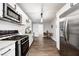 Updated kitchen features modern appliances, white cabinets, and adjacent dining space with ample natural light at 209 Howard Ave, Arcadia, IN 46030