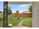 View of a private backyard featuring a wooden fence and a small patio area at 2400 Walnut St, Anderson, IN 46016