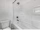 All-white bathroom featuring a tub/shower combination and toilet at 2400 Walnut St, Anderson, IN 46016