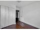 Bedroom with hardwood floors, closet and view into other rooms at 2400 Walnut St, Anderson, IN 46016