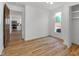 View of bedroom with hardwood floors looking into the kitchen at 2400 Walnut St, Anderson, IN 46016