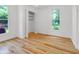 Bedroom with hardwood floors, a window, and a closet at 2400 Walnut St, Anderson, IN 46016
