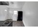 Clean kitchen with a refrigerator, a washer, an exterior door, and natural light at 2400 Walnut St, Anderson, IN 46016