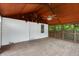 Inviting screened-in porch with wood ceiling and floor, perfect for relaxation and outdoor enjoyment at 2400 Walnut St, Anderson, IN 46016