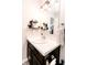 Bathroom featuring a white vanity with marble countertop, modern light fixture, and towel rack at 2550 Cedarmill Dr, Franklin, IN 46131
