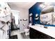 Stylish bathroom with a navy accent wall, elegant vanity, and modern finishes at 2550 Cedarmill Dr, Franklin, IN 46131