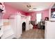 A pink bedroom featuring a whimsical castle bed and a charming play kitchen at 2550 Cedarmill Dr, Franklin, IN 46131