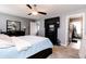 Bright primary bedroom showcasing a TV, modern decor, and soft neutral paint at 2550 Cedarmill Dr, Franklin, IN 46131