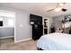 Primary bedroom featuring a TV over a dark dresser, modern lighting, and neutral paint at 2550 Cedarmill Dr, Franklin, IN 46131