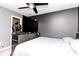 Bedroom featuring a TV, carpet floors, ceiling fan, closet access, and neutral walls at 2550 Cedarmill Dr, Franklin, IN 46131
