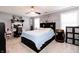 Spacious bedroom with a king-size bed, ceiling fan, and modern decor at 2550 Cedarmill Dr, Franklin, IN 46131