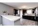 This home offers a spacious kitchen with bar seating and dark wood cabinetry. Great for gatherings! at 2550 Cedarmill Dr, Franklin, IN 46131
