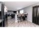 Spacious kitchen blends seamlessly with the living space, featuring a bar and modern appliances at 2550 Cedarmill Dr, Franklin, IN 46131
