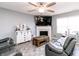Cozy living room with fireplace, TV, and comfortable seating at 2550 Cedarmill Dr, Franklin, IN 46131