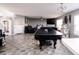 Spacious living room with tile floors, fireplace, and ping pong table offers a large area for entertaining at 2550 Cedarmill Dr, Franklin, IN 46131