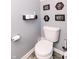 Stylish powder room featuring a toilet, decorative wall art, and modern fixtures at 2550 Cedarmill Dr, Franklin, IN 46131