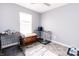 Bright spare room featuring dog kennels, a decorative chest, neutral paint, and gray tile flooring at 2550 Cedarmill Dr, Franklin, IN 46131