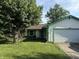 Charming single-story home featuring a well-manicured lawn and attached garage at 3309 Wedgewood Dr, Indianapolis, IN 46227