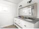 Bathroom vanity with granite countertops and dual sinks at 3936 Graceland Ave, Indianapolis, IN 46208