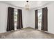 Bright bedroom with two windows and dark curtains at 3936 Graceland Ave, Indianapolis, IN 46208