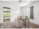 Bright room featuring a large chair, rug, desk, and a window at 3936 Graceland Ave, Indianapolis, IN 46208