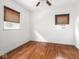 Bedroom features gleaming hardwood floors, and natural light from two windows at 3936 Graceland Ave, Indianapolis, IN 46208