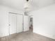 Bedroom with an open closet, white walls, and carpet floors at 3936 Graceland Ave, Indianapolis, IN 46208