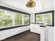 Sunroom with lots of natural light, views of nature, dark trim, and neutral carpet at 3936 Graceland Ave, Indianapolis, IN 46208