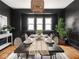 Dining room with black walls, a woven chandelier, and seating for six at 3936 Graceland Ave, Indianapolis, IN 46208