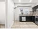 Modern kitchen featuring stainless steel appliances and sleek black cabinets at 3936 Graceland Ave, Indianapolis, IN 46208