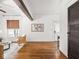Well-lit living room features hardwood floors, modern decor, and beamed ceilings at 3936 Graceland Ave, Indianapolis, IN 46208