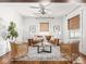 Bright living room featuring hardwood floors and a ceiling fan at 3936 Graceland Ave, Indianapolis, IN 46208