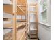 Bright pantry features many rows of wooden shelving, and a window at 3936 Graceland Ave, Indianapolis, IN 46208