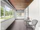 Enclosed front porch with large windows offering plenty of natural light at 3936 Graceland Ave, Indianapolis, IN 46208