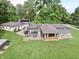 Expansive aerial view of the home, showcasing its location and exterior features with large surrounding trees and a large RV at 3942 Senour Rd, Indianapolis, IN 46239