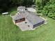 Bird's-eye view showcasing this home's layout with a sprawling lawn, surrounding trees, and an RV at 3942 Senour Rd, Indianapolis, IN 46239