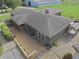 Aerial view showing deck with furniture, well maintained roof, and outbuildings at 3942 Senour Rd, Indianapolis, IN 46239