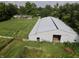 Aerial view of a home and large barn at 3942 Senour Rd, Indianapolis, IN 46239