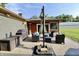 Cozy back patio featuring comfortable seating, a grill, and an umbrella for shaded outdoor enjoyment at 3942 Senour Rd, Indianapolis, IN 46239