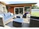 Charming patio space with plush blue cushions and an outdoor heater for year-round relaxation and comfort at 3942 Senour Rd, Indianapolis, IN 46239