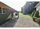 The backyard features gravel area with a pet enclosure and hot tub. A peaceful retreat awaits at 3942 Senour Rd, Indianapolis, IN 46239