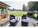 Inviting backyard retreat with a stone fireplace and comfortable seating, perfect for gatherings at 3942 Senour Rd, Indianapolis, IN 46239