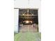 The inside of the barn features natural wood and rustic elements, leading to a bright doorway at 3942 Senour Rd, Indianapolis, IN 46239