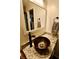 Bathroom featuring a wood sink, granite countertops, bronze faucet, and a large mirror at 3942 Senour Rd, Indianapolis, IN 46239