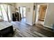 Cozy bedroom featuring hardwood floors, a sliding glass door, and a closet at 3942 Senour Rd, Indianapolis, IN 46239